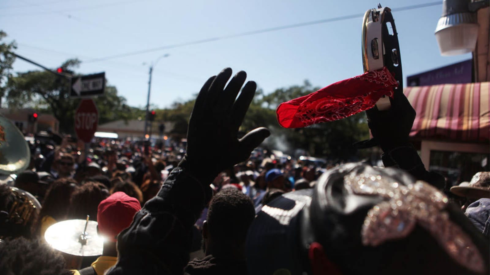  Revelers celebrate during the Ole & Nu Style Fellas second line parade in the historic Treme neighborhood on April 15, 2018 in New Orleans, Louisiana. (Photo by Mario Tama/Getty Images)