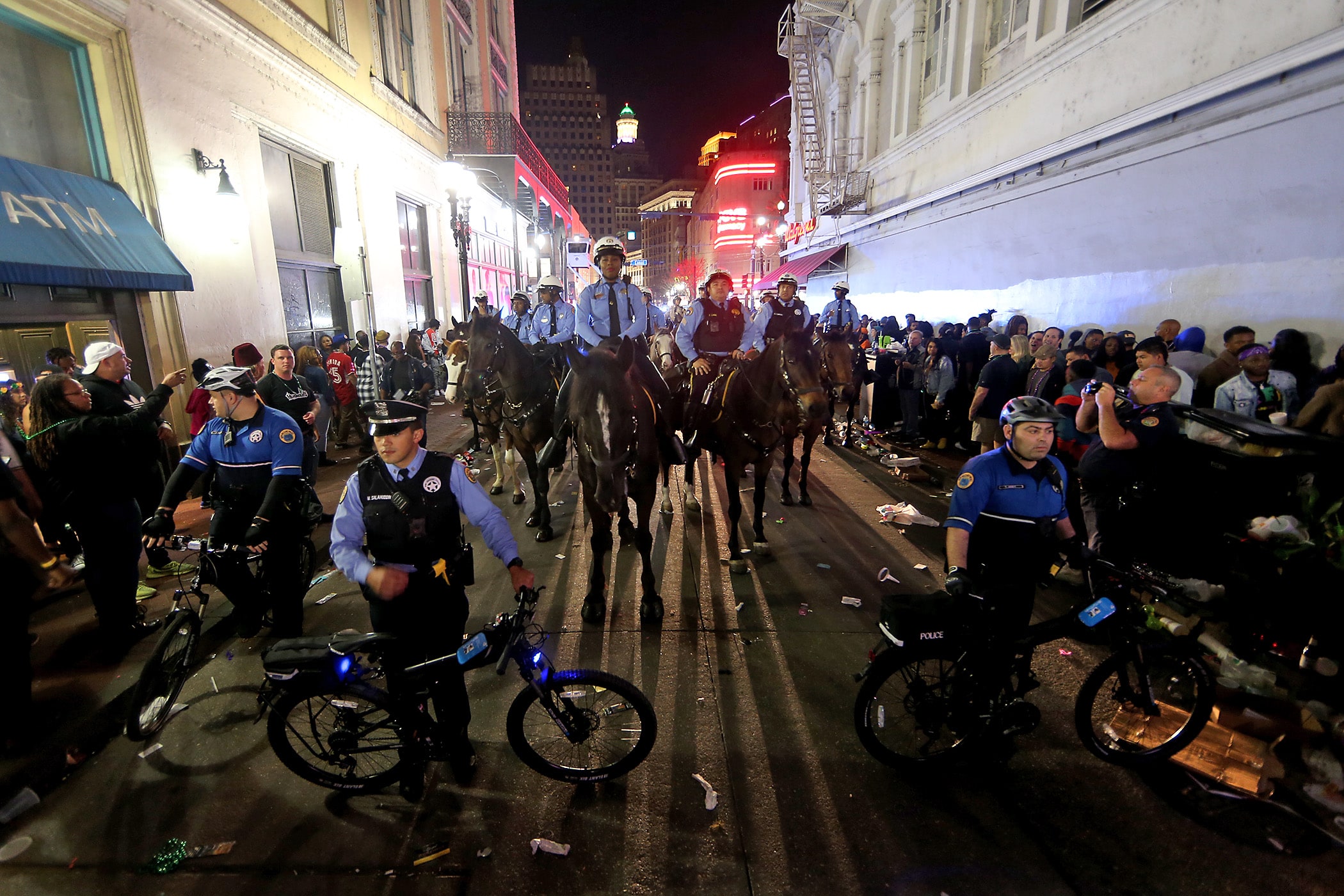 Bike cops and mounted officers line up as New Orleans Mayor LaToya Cantrell, Police Chief Shaun Ferguson and representatives from several state and local police departments as well as first responders prepare to perform the traditional and largely symbolic midnight sweep of Bourbon Street to mark the end of Mardi Gras on Wednesday, February 26, 2020. (Photo by Michael DeMocker)