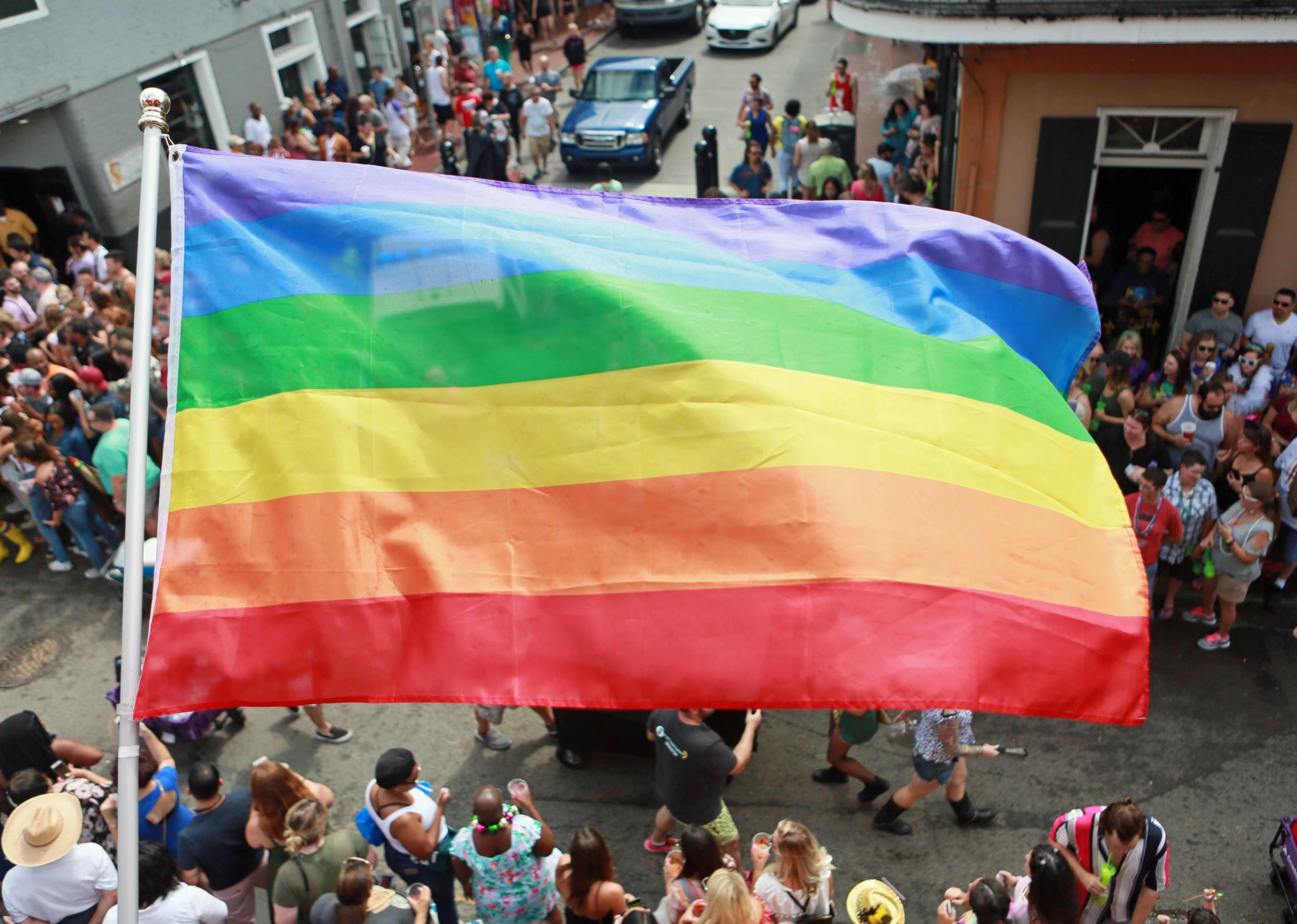 A Pride flag waves in the air while various entertainers and participants march in the Southern Decadence Parade on the St. Louis and Bourbon Street intersection in New Orleans on Sunday, September 2, 2018.  (Photo by Peter G. Forest)