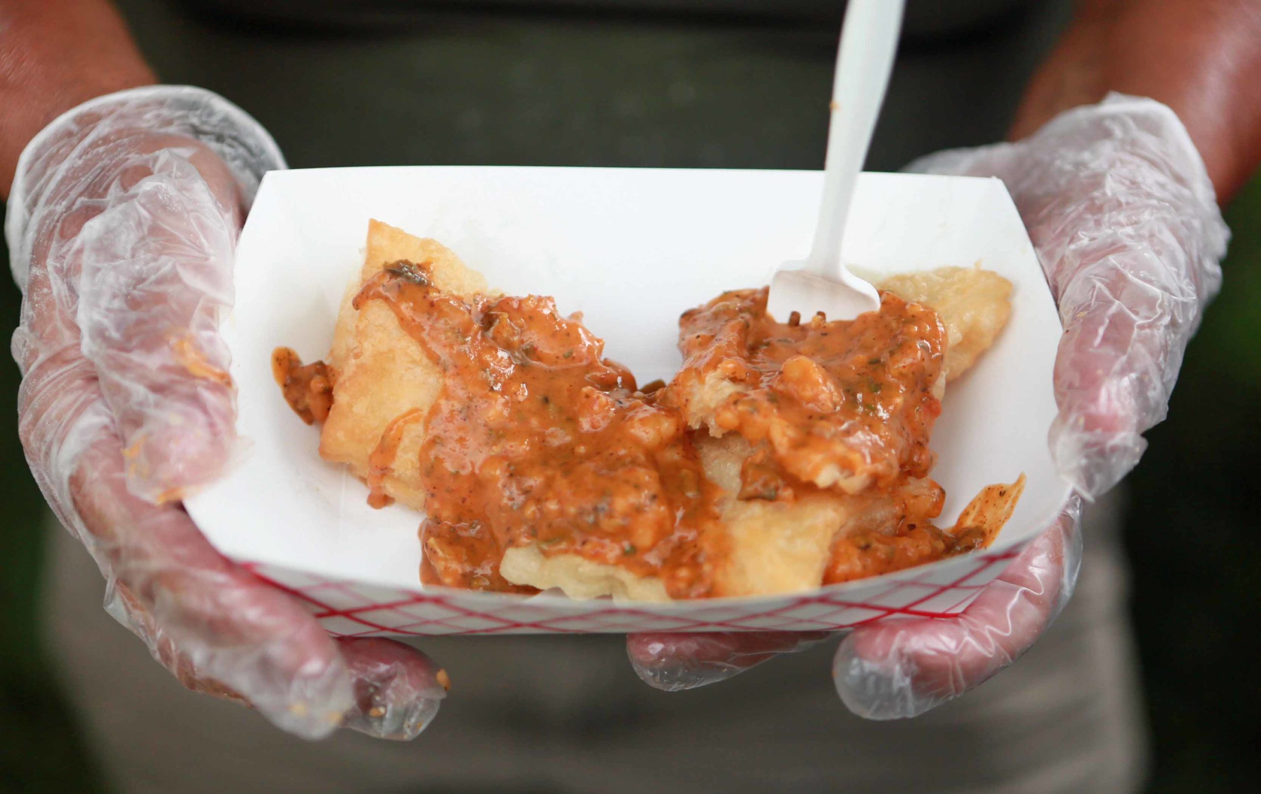 A Shrimp Creole Beignet courtesy of Valerie's Creole Sneaux Catering is on display during the Beignet Festival at the City Park Festival Grounds in New Orleans on Saturday, October 6, 2018.  (Photo by Peter G. Forest)  Instagram:  @forestphoto_llc