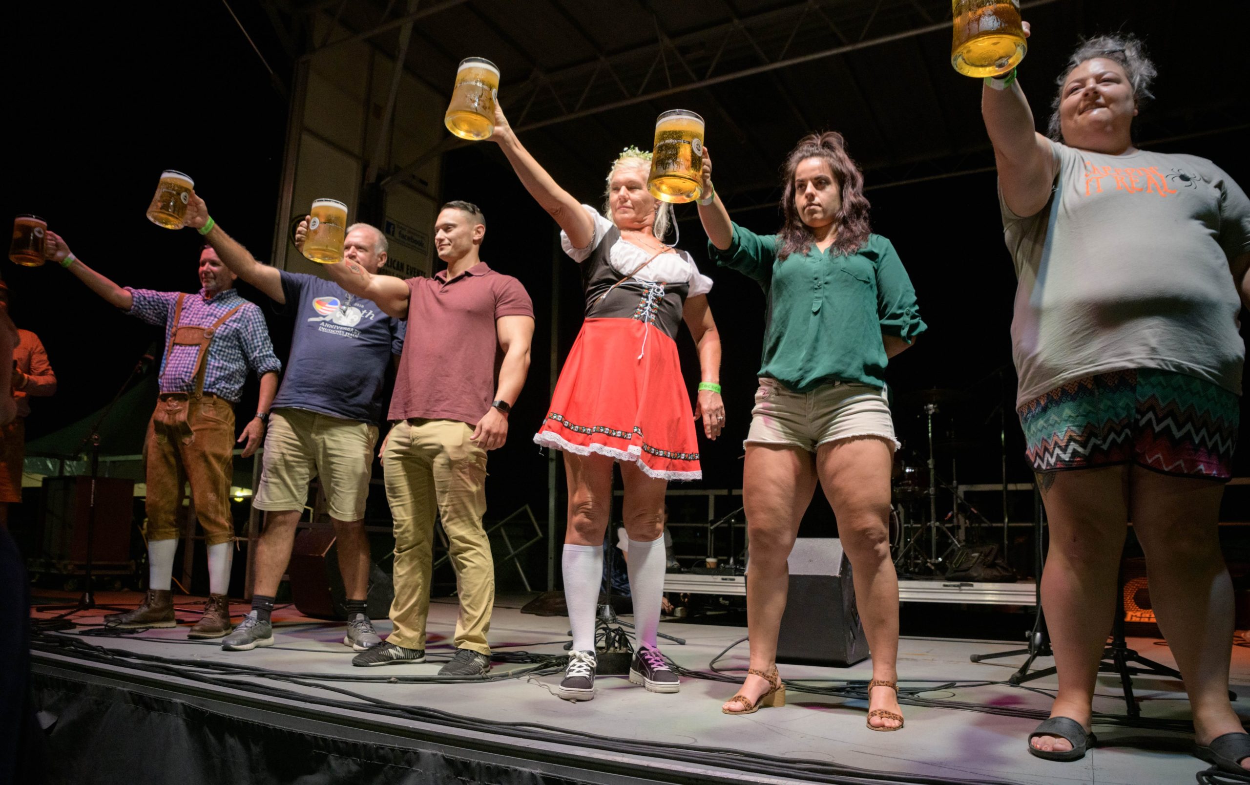 ‘Hold my beer,’ is easy to say but harder to hold for a long time when taking part in the Beer Stein Holding Contest or Masskrugstemmen at Oktoberfest 2019 at the Deutsches Haus in the Bayou St. John neighborhood in New Orleans Friday, Oct. 4, 2019. Besides seeing the hunky winners of the beer holding contest there was plenty of Lederhosen, pretzels, sausage, chicken dances, music, and cheers to go around. The event continues Saturday and will also be held Friday-Saturday for the next two weekends. Photo by Matthew Hinton