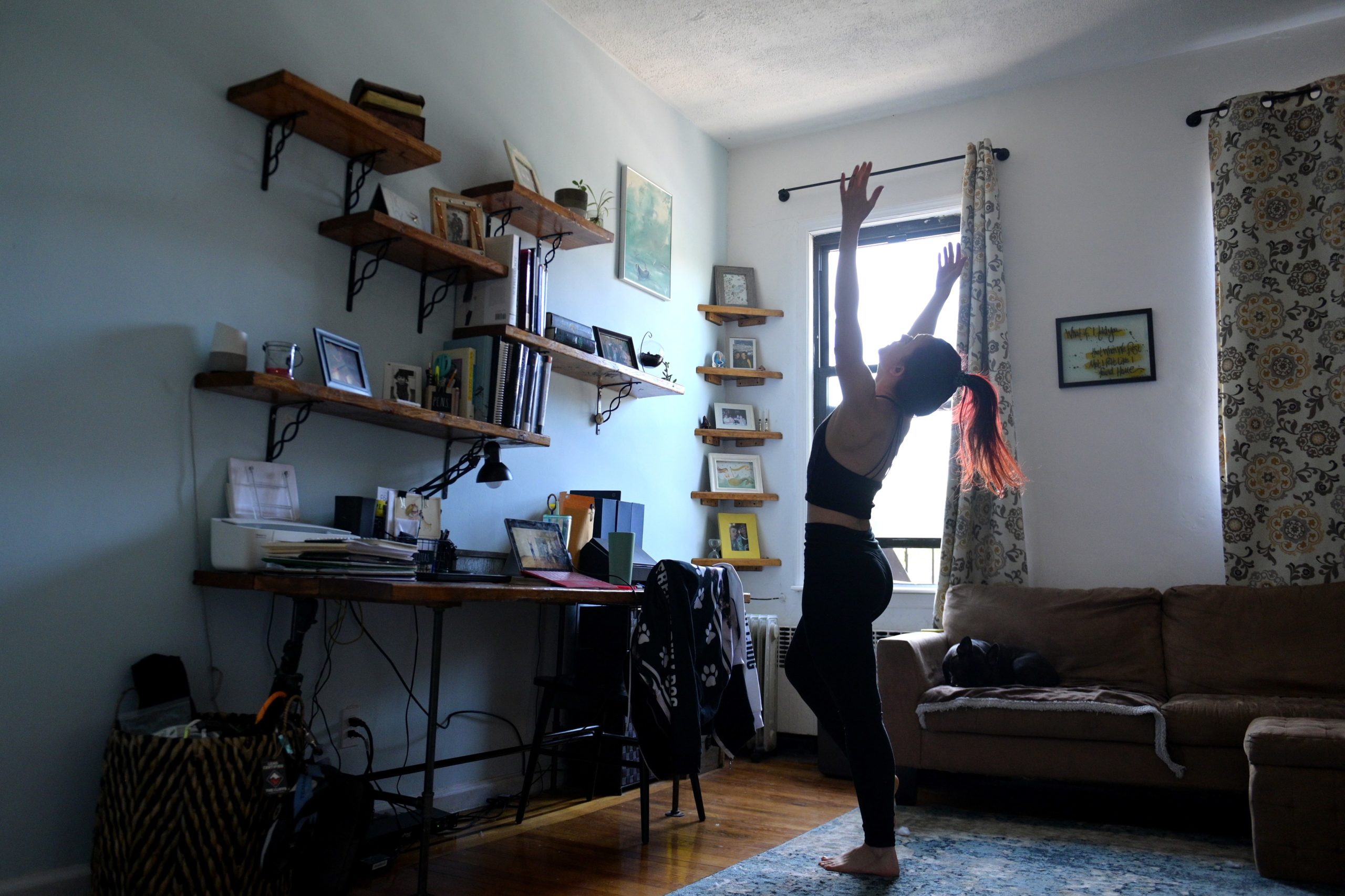 NEW YORK, NEW YORK - MAY 14: Professional modern dancer Kristi Ann Schopfer trains remotely via her laptop in her Brooklyn apartment on May 14, 2020 in New York City. Online education, particularly remote teaching and learning, has spiked considerably due to the spread of coronavirus (COVID-19).  (Photo by Michael Loccisano/Getty Images)