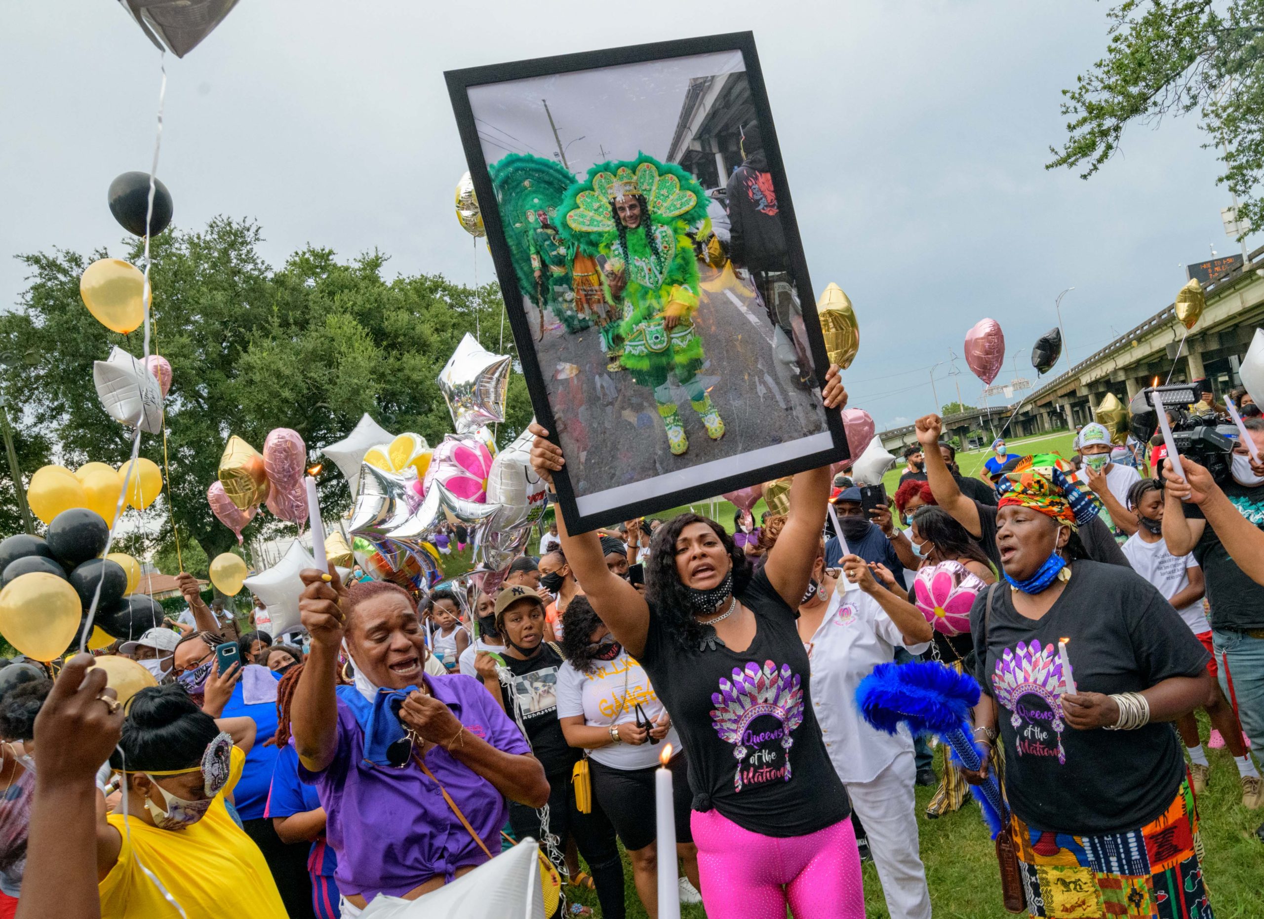 Queens of the Nation formed a circle with candles and balloons to honor Queen Kim. Photos by Matthew Hinton