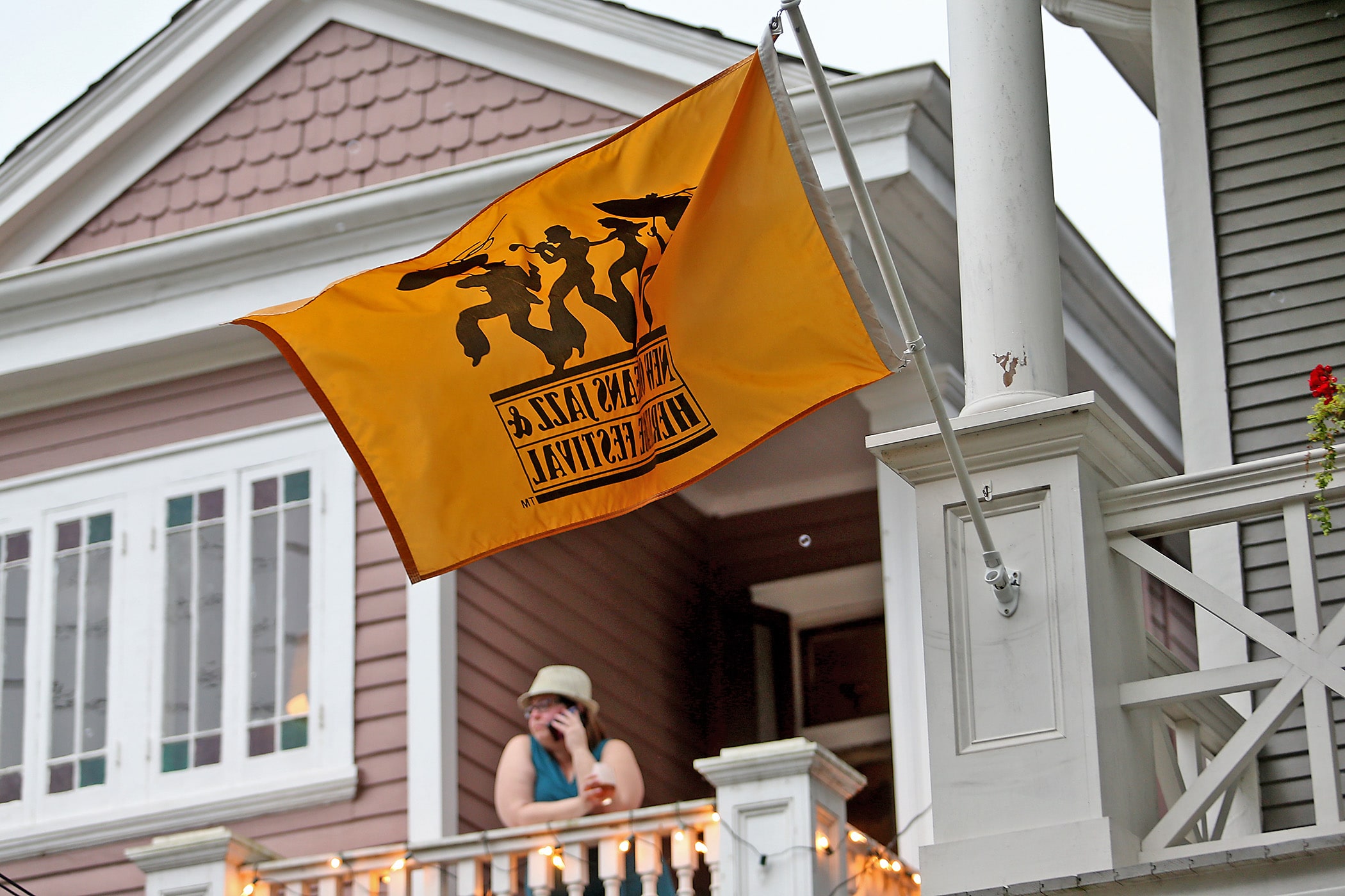 Neighbors take to their balconies and porches on Esplanade Avenue after the New Orleans Jazz &amp; Heritage Festival was cancelled by the Covid-19 pandemic. Photographed on Saturday, April 25, 2020. (Photo by Michael DeMocker)