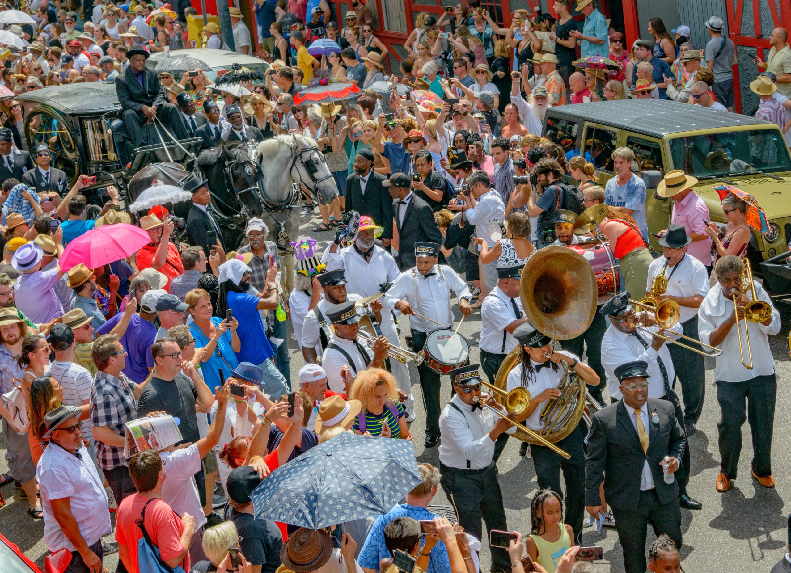 Lead by the Kinfolk Brass Band, the Young Men Olympian, Jr. Benevolent Association, and a horse-drawn hearse carrying Dr. John, the main line of the funeral processes past the second line of mourners as they honor Malcolm John "Mac" Rebennack, Jr. also known as Dr. John (November 20, 1941 – June 6, 2019) with a jazz funeral from the Orpheum Theater in New Orleans, La. Saturday, June 22, 2019. Rock and Roll Hall of Famer Dr. John was a worldwide ambassador for New Orleans music blending jazz, funk, blues, pop, boogie woogie, and rock and roll. Photo by Matthew Hinton