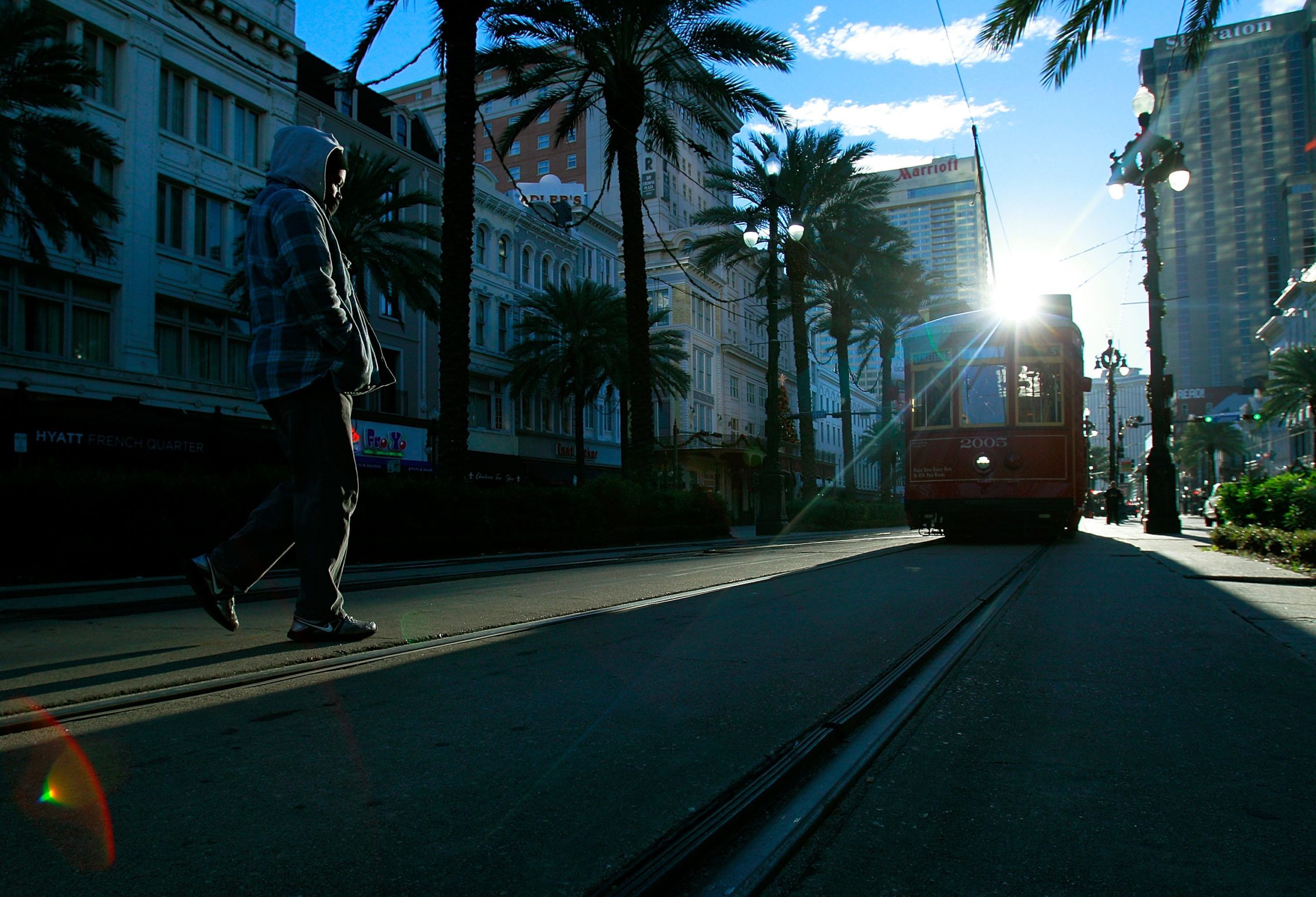 NEW ORLEANS, LA - JANUARY 07:  A man walks to catch the Street Car on Canal Street as temperatures in the area plummeted below freezing on January 7, 2014 in New Orleans, Louisiana. Highs are expected be in the upper 30's in metro New Orleans. A "polar vortex" carrying Arctic air and wind gusts of up to 50 mph has engulfed much of the Northeast making for life threatening weather conditions.  (Photo by Sean Gardner/Getty Images)