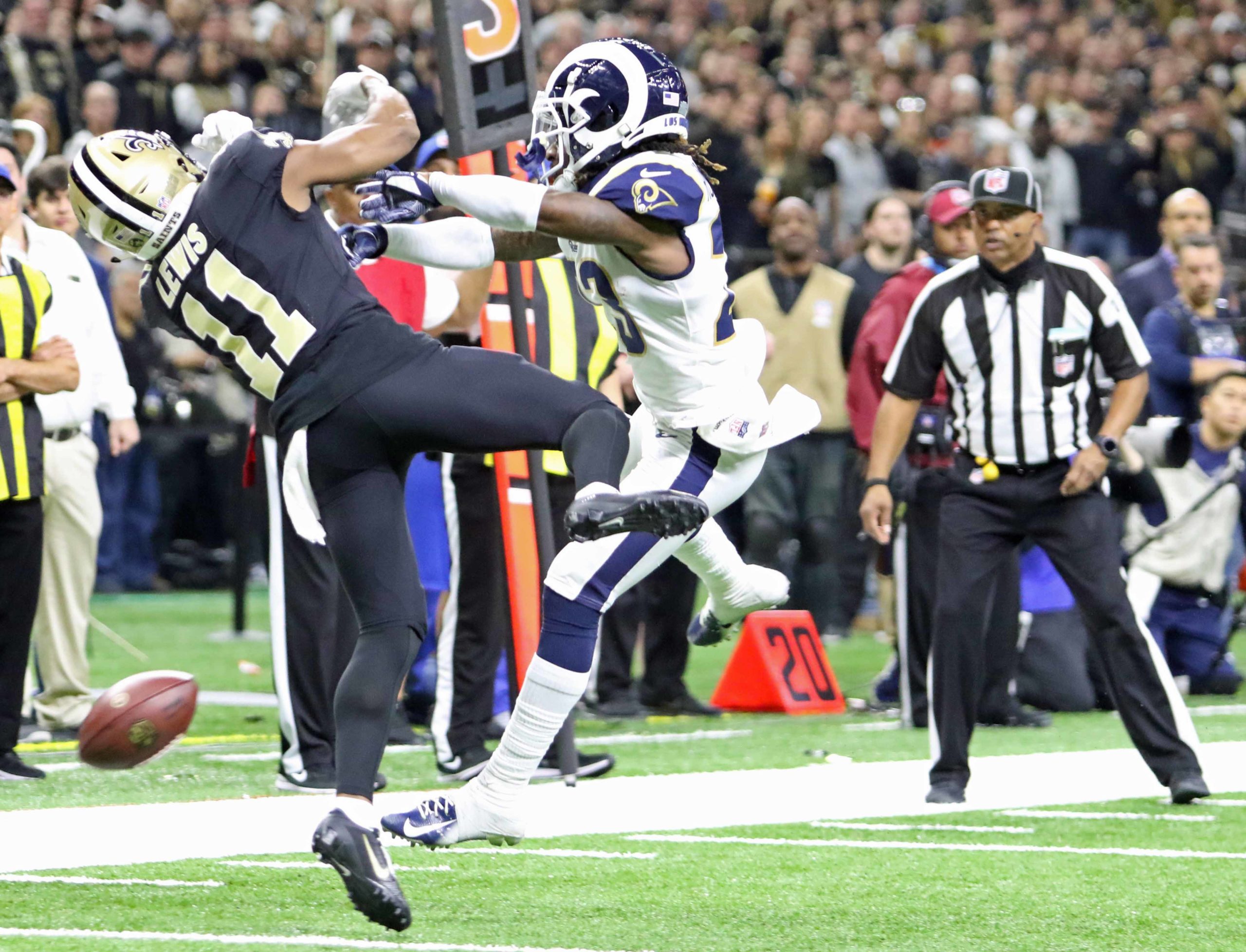 New Orleans Saints wide receiver Tommylee Lewis (11) takes a hard hit by Los Angeles Rams defensive back Nickell Robey-Coleman (23) near the sideline before the ball reaches him during the NFC Championship Game at the Mercedes-Benz Superdome in New Orleans on Sunday, January 20, 2019.  No pass interference was called on this play which forced the Saints to kick a field goal instead of a first down.  (Photo by Peter G. Forest)