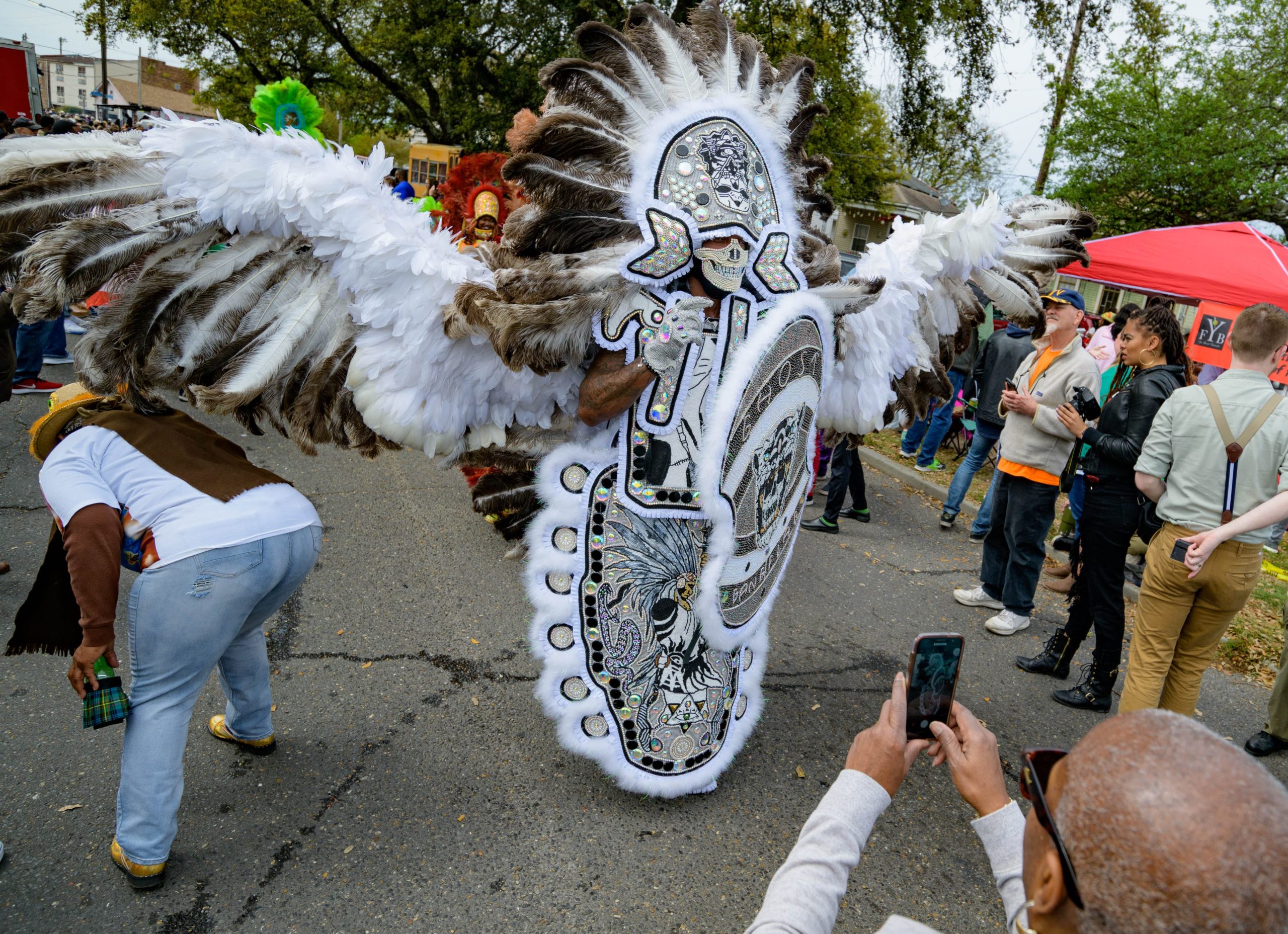 Steve Austin, the Ghost Gang Flag of the Black Mohawk Mardi Gras Indians, has a wing span of more than a car length on Super Sunday, March 17, 2019, in New Orleans, La. Photo by Matthew Hinton