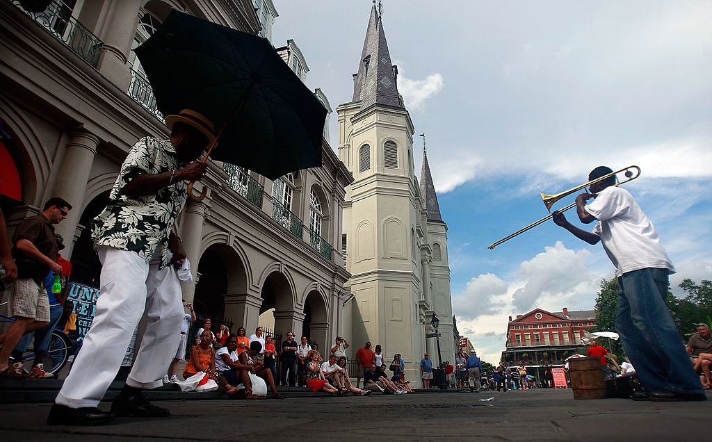 NEW ORLEANS - MAY 15:  A band performs in the French Quarter May 15, 2009 in New Orleans, Louisiana. Tourism is the number one industry in New Orleans, over 400,000 people attended this years JazzFest, the largest crowd since Hurricane Katrina. New Orleans continues to be revitalized with $19 billion in federal rebuilding money yet to be spent along with $3.8 billion in federal stimulus funds in the pipeline. However the city still has more than 68,000 vacant homes, most of which have were damaged by Hurricane Katrina in August, 2005.  (Photo by Mario Tama/Getty Images)