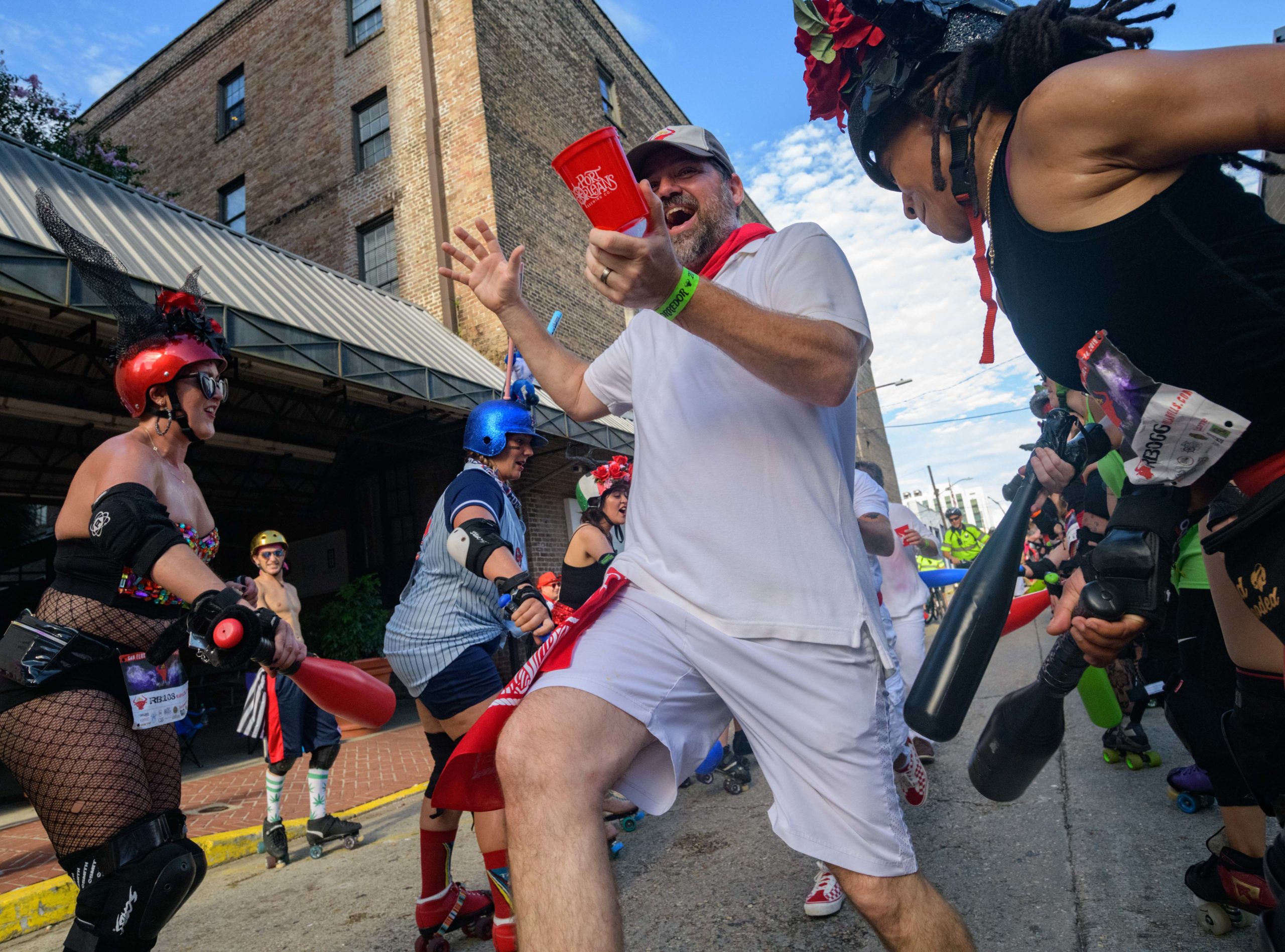 Roller Derby Girls dressed as bulls take part in San Fermín in Nueva Orleans at the Sugar Mill Saturday, August 24, 2019. The NOLA Running of the Bulls parodies the same event in Pamplona, Spain in July and is usually held the same weekend but the New Orleans event was postponed due to Hurricane Barry. The Big Easy Roller Girls and other roller derby groups from around the country whack the behinds of runners with whiffle ball bats and the ladies bring the horns. Various Mardi Gras Krewes take part including the Rolling Elvi, the Merry Antoinettes, and Lucha Krewe. Photo by Matthew Hinton