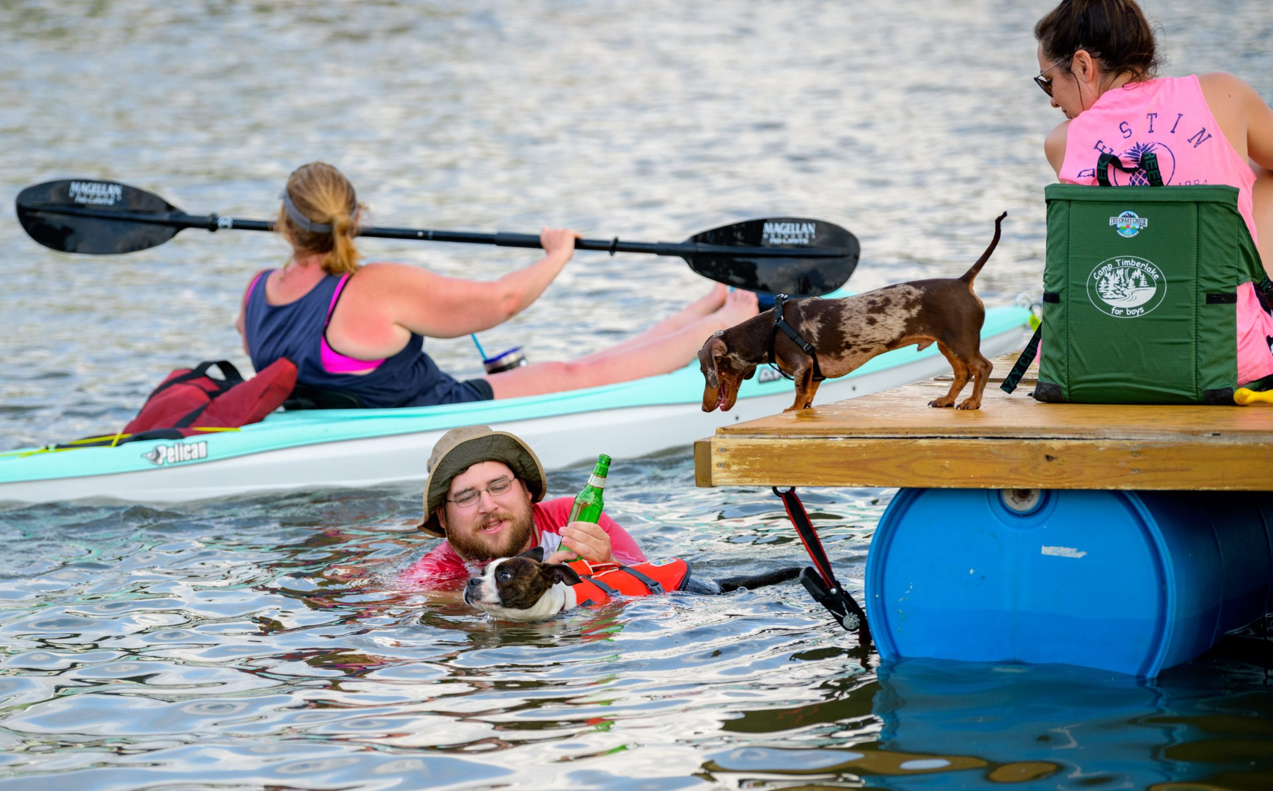 People float on Bayou St. John during the Mid-City Bayou Boogaloo in New Orleans, La. Saturday, May 18, 2019. Described as a mini-Jazz Fest the now three day festival features New Orleans music, art, cuisine and culture. The event was created in 2006 to reinvigorate the Mid City neighborhood after Hurricane Katrina. Photo by Matthew Hinton