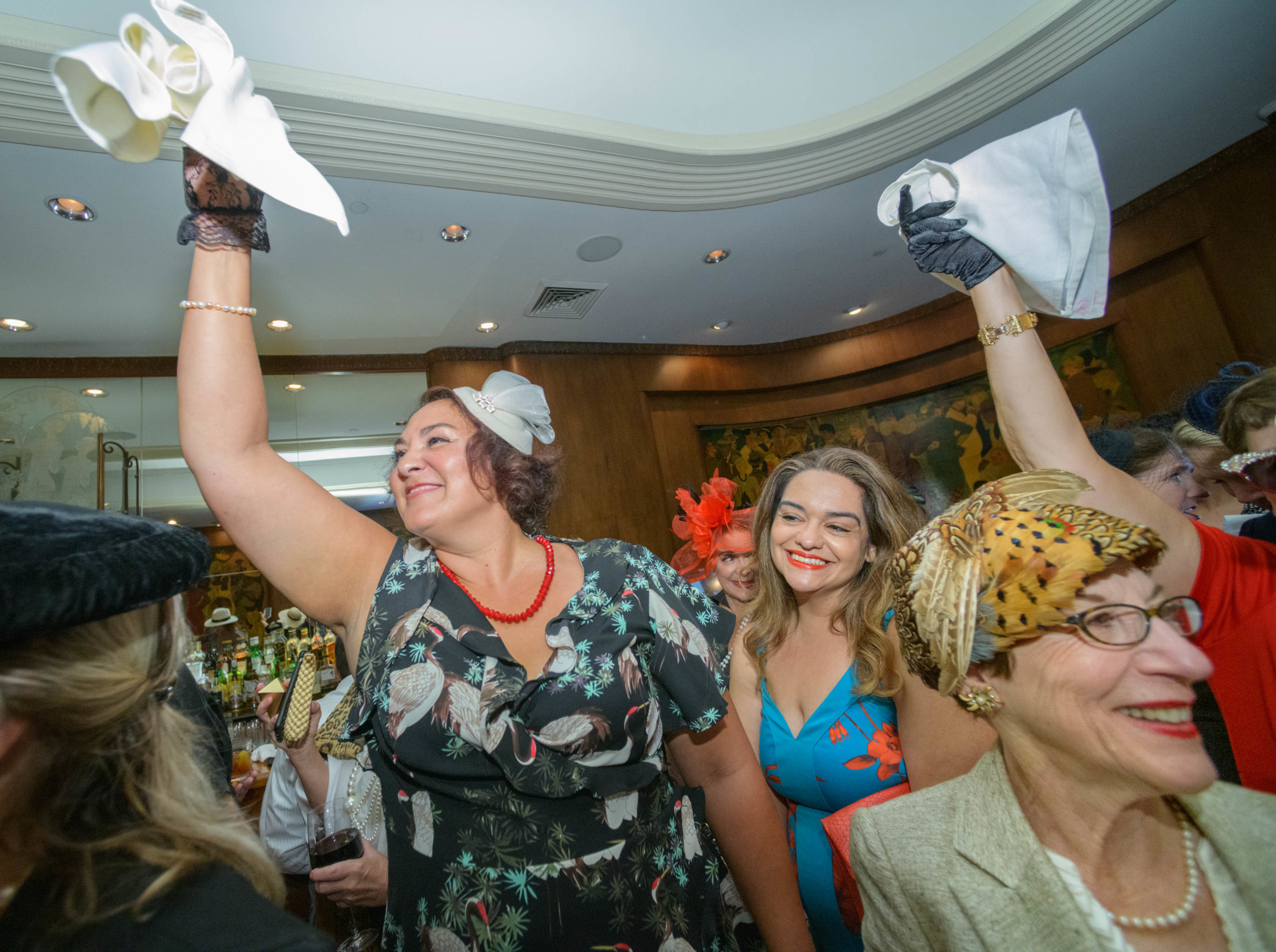 Women commemorate the 70th anniversary of the Stormin’ of the Sazerac bar at the Roosevelt Hotel in New Orleans, September 20, 2019. The Sazerac bar excluded women except on Mardi Gras until September 26, 1949 when women ‘stormed the bar.’ The event was celebrated first with a luncheon and fashion show at the Blue Room before the group of women second lined to the Sazerac bar with music by the Twisty River Band. WDSU anchor Charles Divins hosted and WDSU Chief Meteorologist Margaret Orr, who was the reigning Spirit of the Sazerac, announced this year’s Spirit as Meaghan Ryan Bonavita, the president of Dress for Success New Orleans that provides women in need with clothing for jobs. Photo by Matthew Hinton