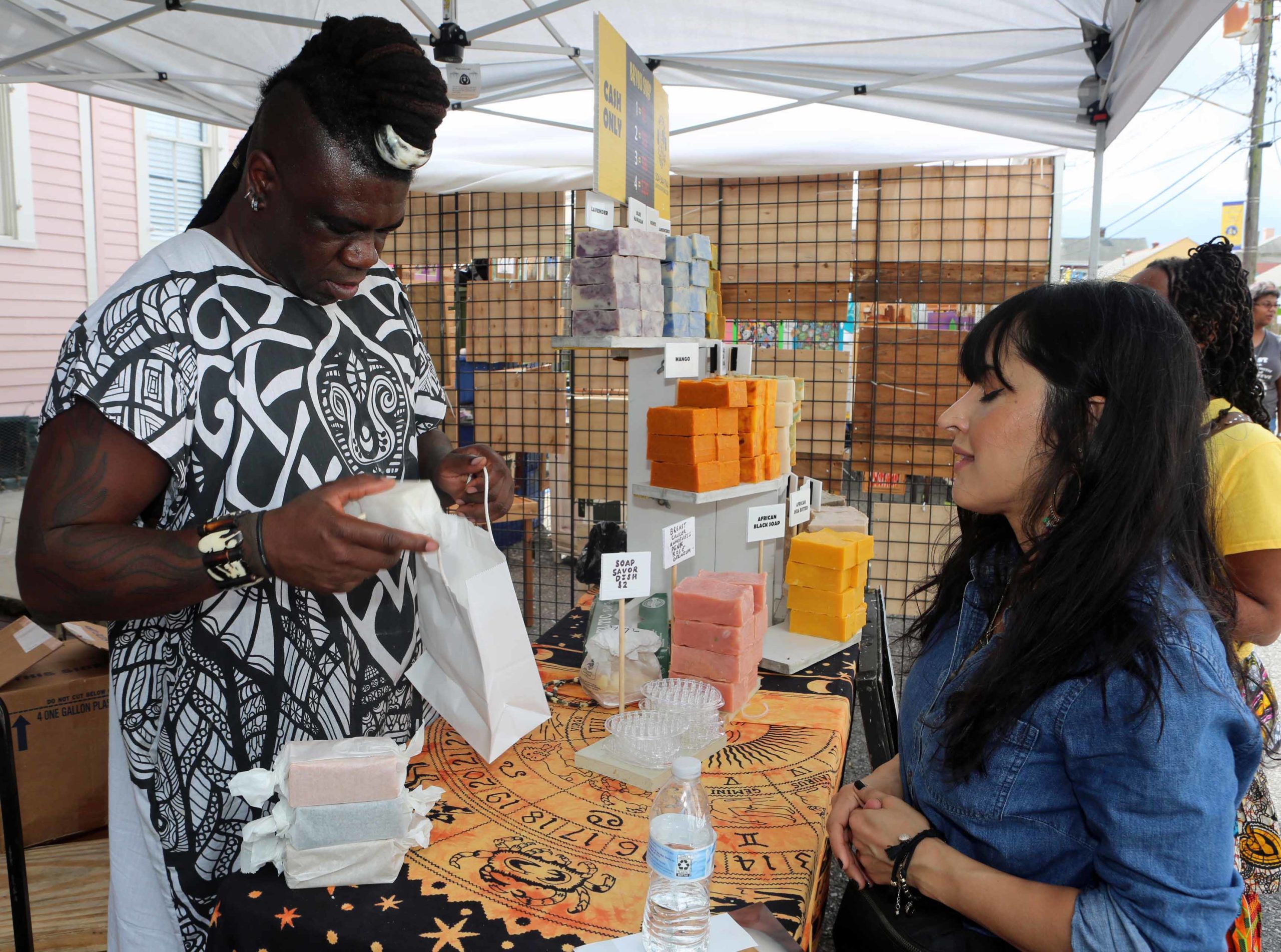 "The Soapmaster" pack blocks of Bayou Soap Company soaps for Malak Mojaddidi during the Treme Festival at St. Augustine Catholic Church in New Orleans on Saturday, October 6, 2018.  (Photo by Peter G. Forest)  Instagram:  @forestphoto_llc