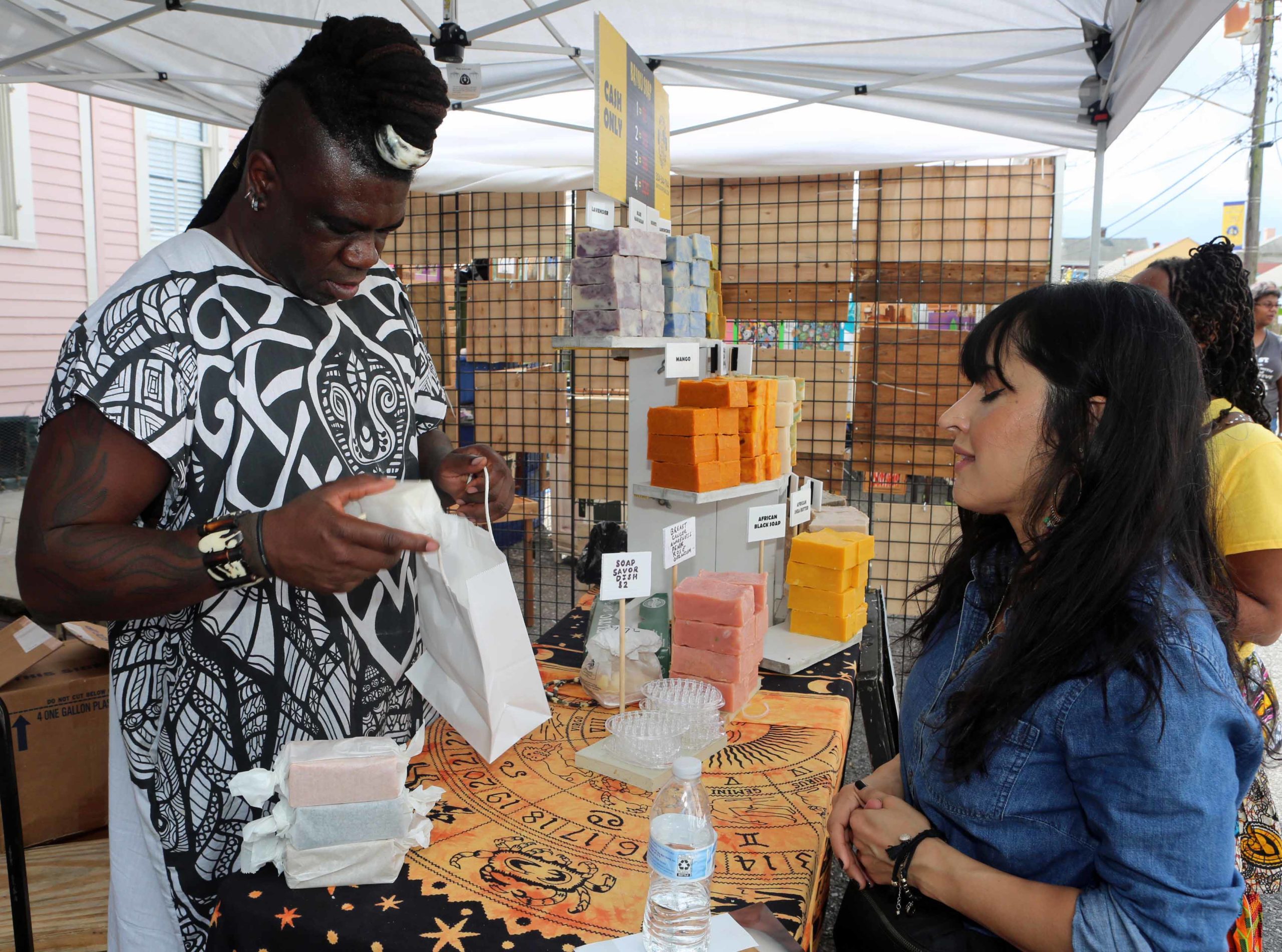 "The Soapmaster" pack blocks of Bayou Soap Company soaps for Malak Mojaddidi during the Treme Festival at St. Augustine Catholic Church in New Orleans on Saturday, October 6, 2018.  (Photo by Peter G. Forest)  Instagram:  @forestphoto_llc